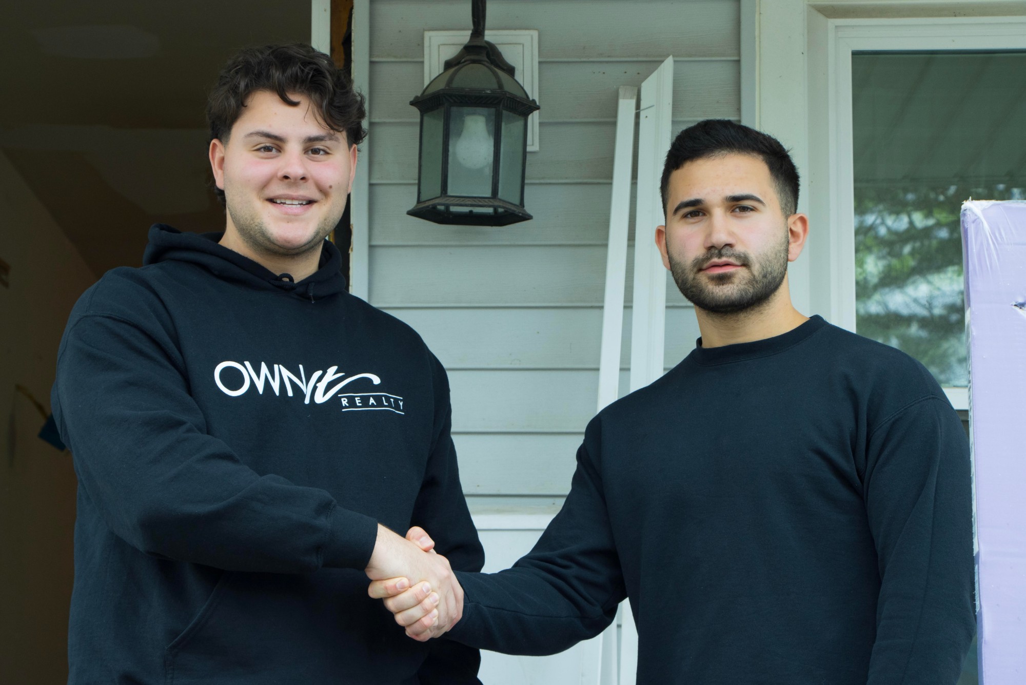 Isaac and Mike shaking hands on a closed deal