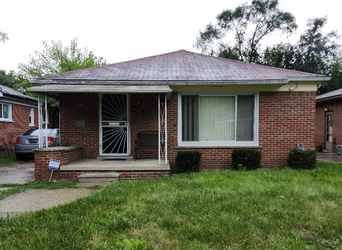 Brick tudor-style home purchased by DoneDealHomes